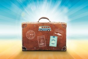 Suitcase with labels on it - Covid-19 and Holiday Entitlements